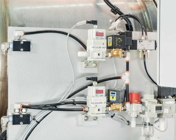 Pneumatic manifold panel showing SMC digital vacuum transducer (kPa) and SMC pressure transducer with Sirai solenoid valves and push-to-connect fittings
