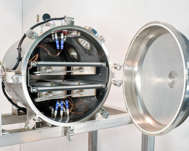 Interior of OTC-3.0AL vacuum chamber showing four stainless steel tray drawers on rails with thermocouple fittings and internal heating/cooling elements