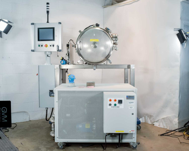 Opti Temp OTC-3.0AL full system overview — vacuum chamber on steel frame above integrated chiller unit with NI touchscreen control panel mounted to left