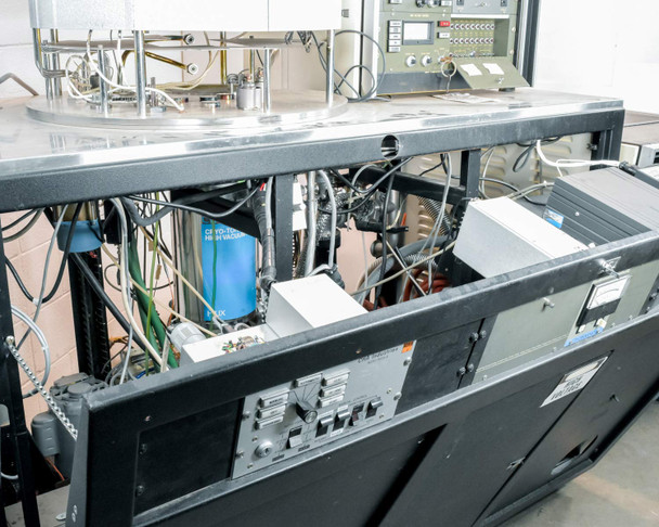 CHA Industries SEC-600 cabinet interior — wiring, blue capacitor, circuit boards, and subsystem modules visible under open access panel