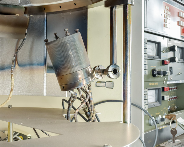CHA Industries SEC-600 e-beam gun assembly — cylindrical electron beam gun tilted and mounted inside the open deposition chamber