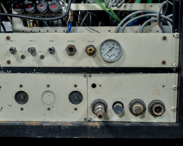 CHA Industries SEC-600 gas manifold panel — Gas 1–4, Vent, Air Out, Air In fittings with pressure gauge; wear and corrosion visible on panel surface
