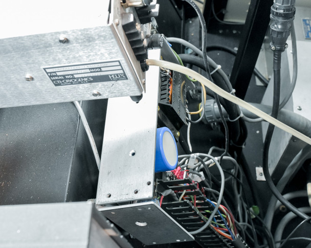 CTI-Cryogenics Cryo-Torr 8 pump module (P/N label visible) mounted inside CHA SEC-600 cabinet with surrounding wiring and components
