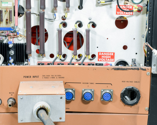 CHA Industries SEC-600 power input panel — labeled 208/240V 70A 50/60Hz 3-Phase 3 Wire & Ground; vacuum tank connectors and high-voltage cable connectors; Danger High Voltage stickers visible