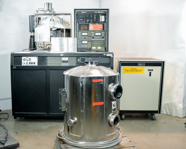 CHA Industries SEC-600 vacuum deposition system overview — bell jar in foreground on pallet, main cabinet and power unit in background