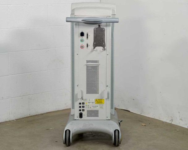 Lumenis Novus Varia rear view showing ventilation grille, connection panel with fiber ports and circular connectors, power inlet area, and mobile caster base