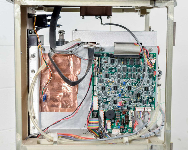 Lumenis LightSheer XC – side interior view showing secondary control PCB, copper shielding tape, and plumbing/tubing connections