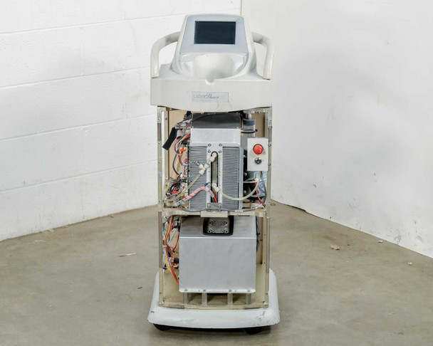 Lumenis LightSheer XC laser system – front view showing open chassis, internal boards, red emergency stop button, and touchscreen display