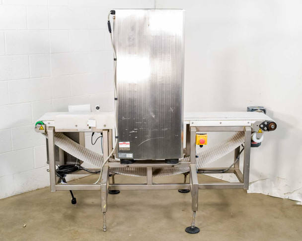 CEIA THS/MS21 metal detector — rear view of complete conveyor system showing back of stainless steel detector head, belt, frame, adjustable feet, and right-side control panel