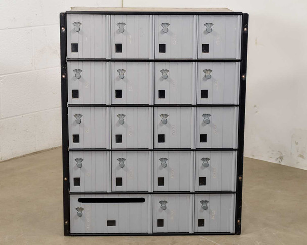 Salsbury 3620 mailbox unit front view – 5 rows of 4 doors each with spinning combination locks and mail drop slot