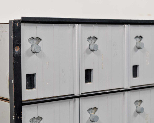 Salsbury 3620 mailbox close-up – top row of doors showing spinning combination lock dials and door panel detail