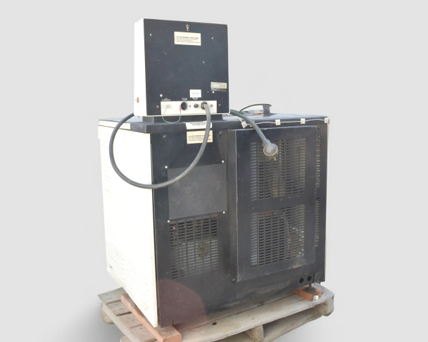 Beckman L5B-CT rear three-quarter view showing full black louvered rear enclosure, control panel box mounted on top, and vacuum hose connections