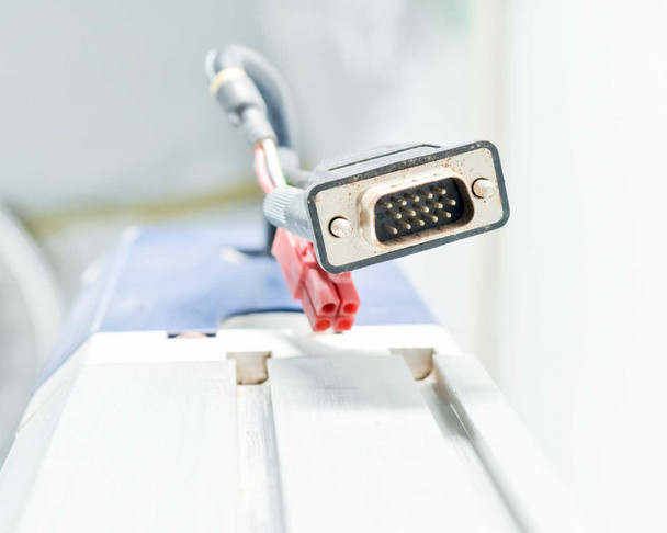Close-up of DB15 HD-15 motor encoder connector and red power connector attached to Adept L12 linear module motor housing