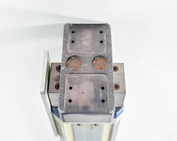 Adept L12 Python linear module top end view showing carriage mounting plate with two circular through-holes and mounting bolt pattern