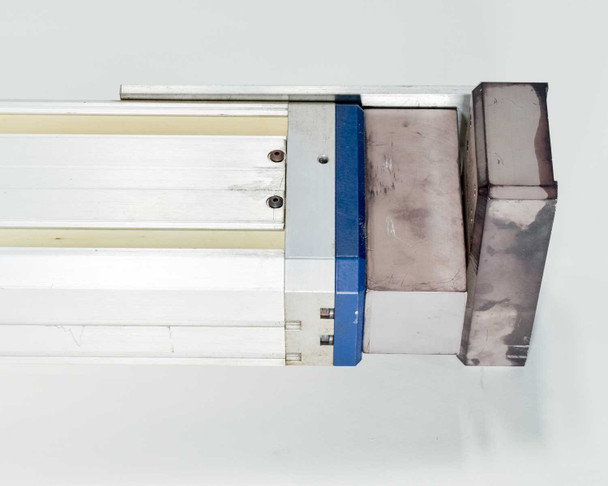 Adept L12 linear module carriage end view showing aluminum end block, blue belt seal, and rail cross-section