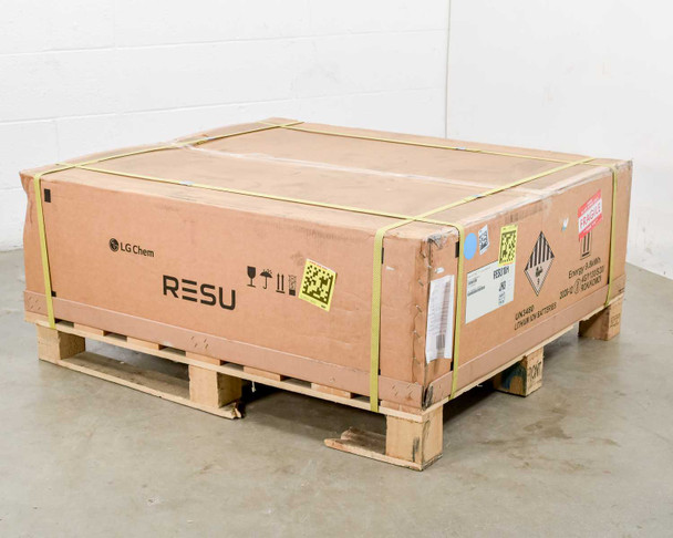 LG Chem RESU10H palletized shipping box — three-quarter front view showing LG Chem and RESU branding on two faces, yellow pallet straps, and hazmat and Fragile labels
