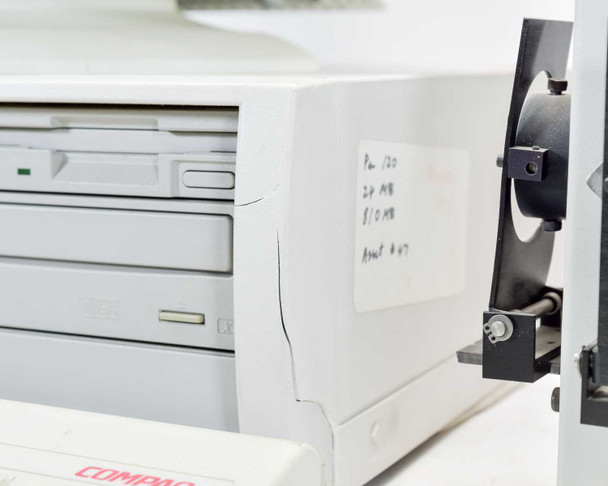 HP Vectra XM 5/120 Series 4 right side showing cracked computer casing and hand-written note on side panel; Compaq label and optical drive visible