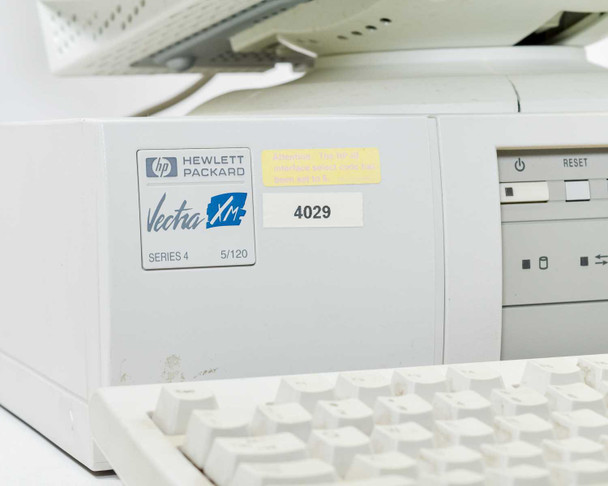 HP Vectra XM 5/120 Series 4 front badge close-up — Hewlett Packard Vectra XM Series 4 5/120 logo, asset tag 4029