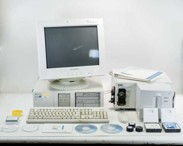 Labsphere RSA-HP-8453 complete system overview — spectrophotometer, HP Vectra PC, Hyundai monitor, keyboard, calibration standards, CDs, and accessories laid out on table