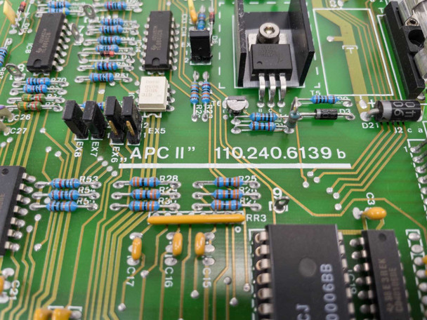 Netstal APC2 110.240.6139b PCB close-up showing silk-screen label 'APC II 110.240.6139 b' and IC components