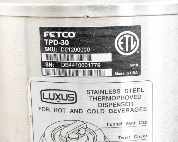 Fetco Luxus TPD-30 thermal dispenser label showing model TPD-30, SKU D01200000, SN DB4410001779, ETL listed, Made in USA