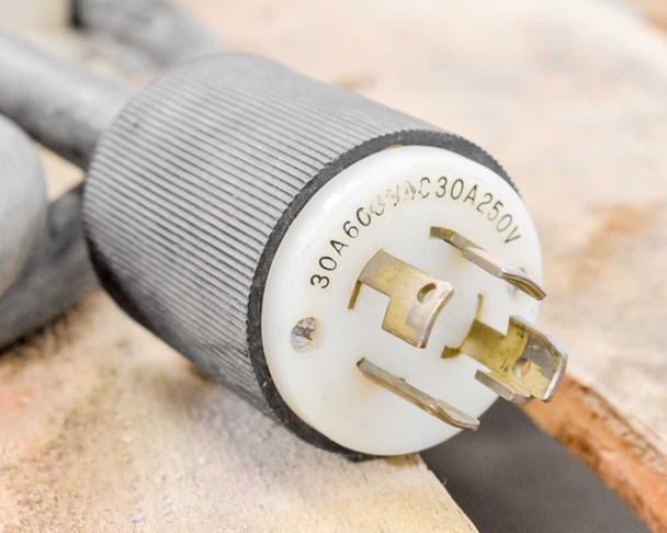 Fetco CBS-61H power cord twist-lock plug close-up showing 30A 600V 4C 30A 250V rating markings