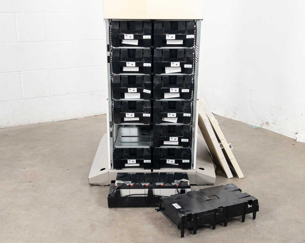 Best Power Axxium Pro 18kVA UPS — front panel fully removed showing all 12 module slots with black battery module handles installed, one battery module removed and sitting on floor