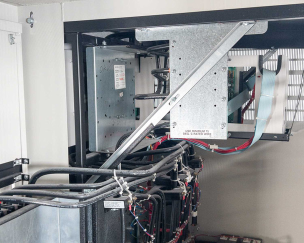 PDI Power Pak M-4 interior upper section — M-4 monitor electronics module, cable management, and internal wiring with label reading USE MINIMUM 75 DEG C RATED WIRE