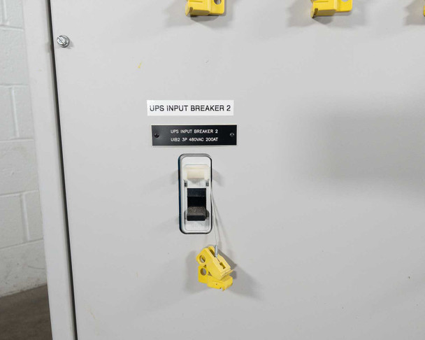 UPS Input Breaker 2 panel – breaker switch labeled UIB2 3P 480VAC 200AT with yellow lockout hasp