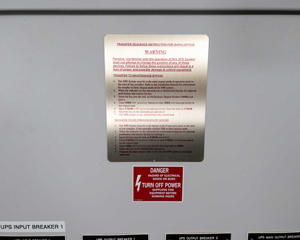Transfer sequence instruction label and danger warning placard on inside of cabinet door