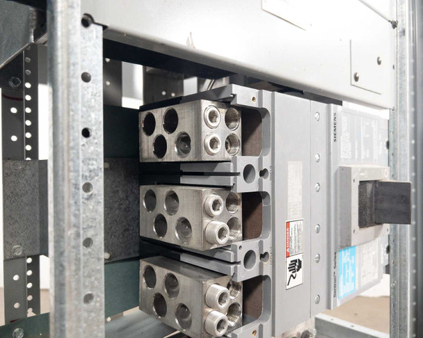 Siemens switchboard main bus bar assembly — three-phase lug stack closeup, wiring removed
