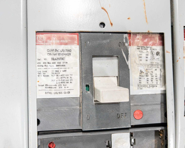 GE Spectra RMS Current Limiting Circuit Breaker Cat. No. SGLA36AT0400, 400A, 600VAC, 3-Pole – label and breaker handle close-up, INSTALL LUG/BUS COVER note visible