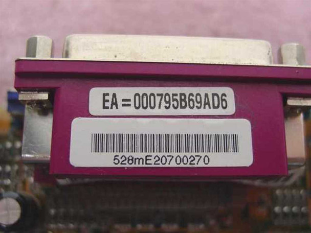 PC Chips 528mE11 motherboard label closeup showing serial number 528mE20700270 and EA code 000795B69AD6