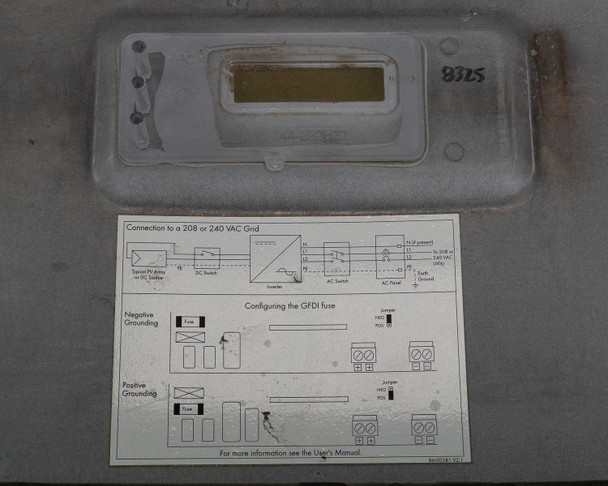 SMA Sunny Boy SB 3800-US-10 — front door panel removed showing LCD display assembly and wiring/configuration diagram card for 208/240VAC grid connection and GFDI fuse configuration