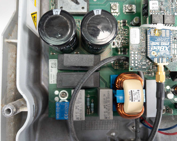 SMA Sunny Boy SB 3800-US-10 — close-up of upper PCB corner showing XBee PRO 825 wireless module, large electrolytic capacitors, and additional inductors