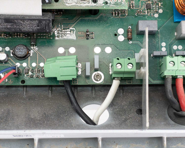 SMA Sunny Boy SB 3800-US-10 — close-up of lower PCB area showing detached green plug connector near NEG/POS board markings — as-is fault clearly visible