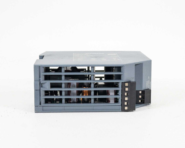 Siemens SITOP PSU100S – top view showing ventilation fins and internal transformer coil visible through vents, output terminal block at rear