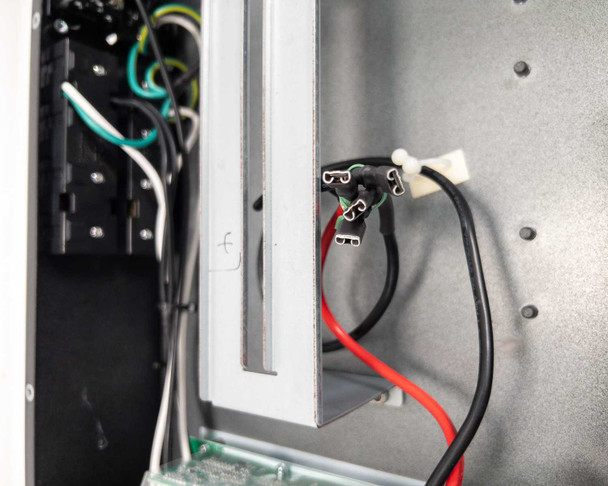 Xtreme Power Conversion V80-1500 UPS – interior close-up showing battery connector harness and wiring detail