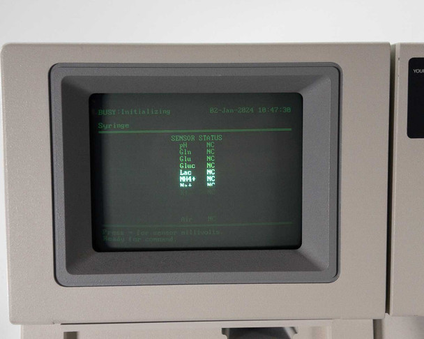 Nova Biomedical BioProfile 100 Plus CRT display – sensor status screen showing pH, Gln, Gluc, Lac, NH4+, Na+ all reading NC during initialization, dated 02-Jan-2024