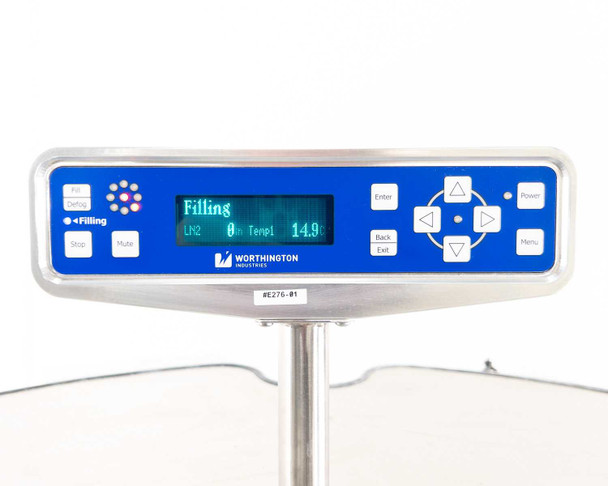 CS200 cryogenic controller close-up — blue panel with LCD display reading 'Filling LN2 0m Temp 14.9', keypad controls, and Worthington Industries branding