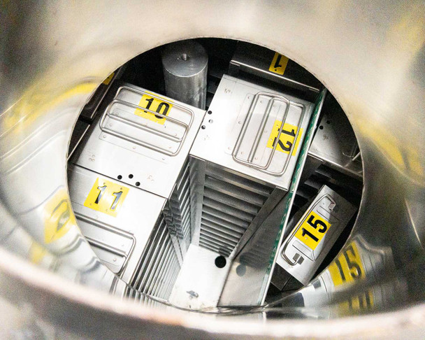 Interior top-down view of LABS20K-CS showing numbered stainless steel storage racks (positions 10, 11, 12, 15 visible) seated on the turntable