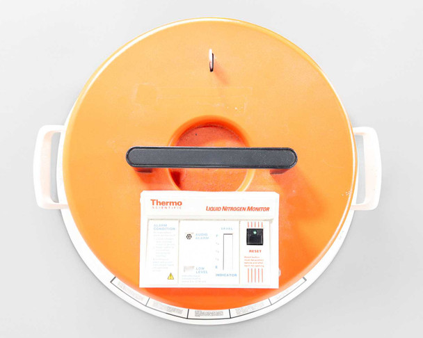 Thermo Scientific Locator 4 CN509X17 orange lid top-down view with ultrasonic liquid nitrogen monitor mounted on lid showing RESET button and indicator panel