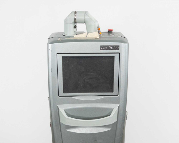 Lumenis AcuPulse 40 AES-A top panel showing cracked housing, tape residue, articulated delivery arm base, red E-stop button, and indicator lights