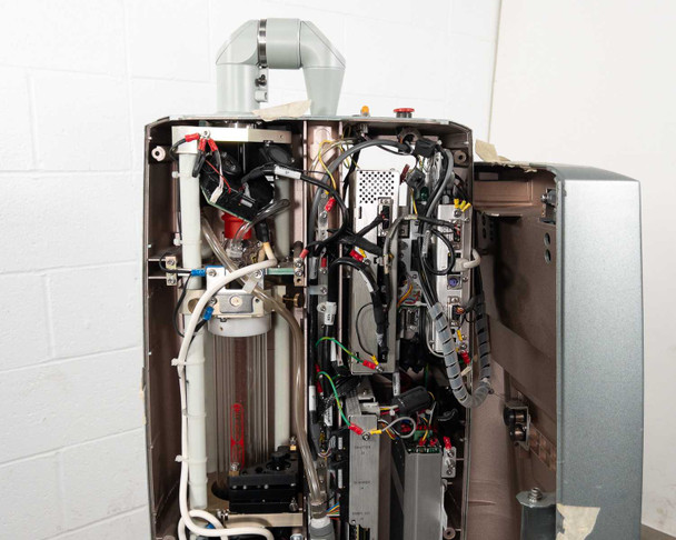 Lumenis AcuPulse 40 interior — front cover removed, showing internal wiring harness, fans, tubing, boards, and laser chassis components