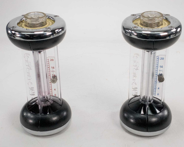 Bacharach Fyrite tester pair — both CO2 and O2 Fyrite testers side by side showing graduated clear tubes with 0–20 scale markings and chrome and black housings