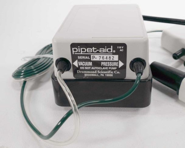 Drummond Pipet-Aid DP-111 label closeup showing Vacuum and Pressure ports, 115V AC rating, serial number, and Drummond Scientific Co. Broomall PA branding