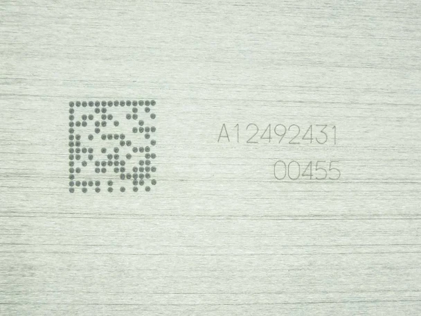 Close-up of Nanosolar NanoCell aluminum substrate back showing laser-etched serial number A12492431 and lot code 00455
