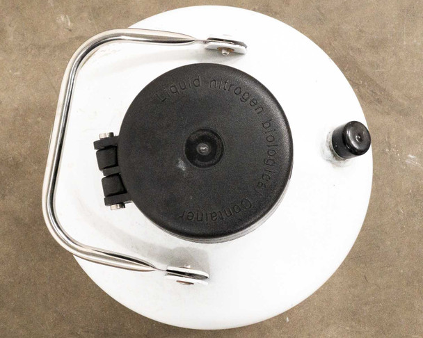 Top view of YDS-6 dewar showing black plastic lid, stainless bail handle, and pressure relief plug