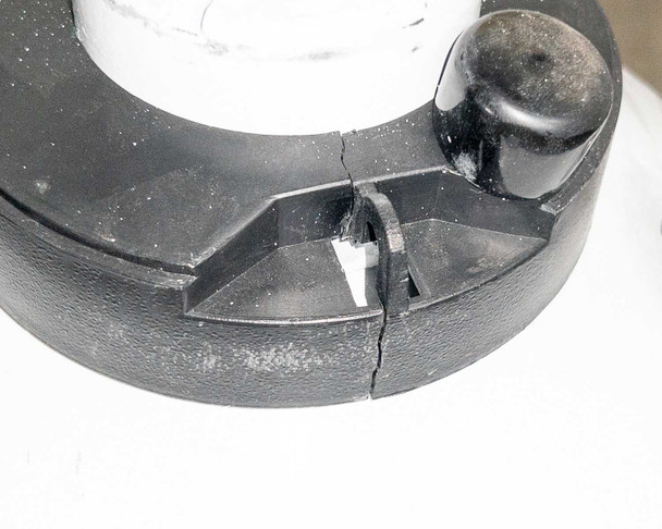 Close-up of cracked top hasp/latch on YDS-6 dewar lid showing damage detail