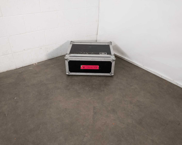 Tour Supply 4U ATA road case closed, three-quarter view from front showing draw clamp latches and red tour label on front panel
